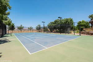 View of tennis court featuring community basketball court