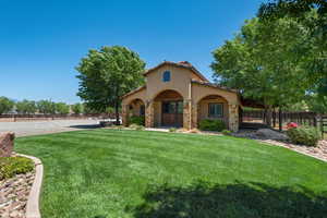View of front facade with stucco siding and stone siding