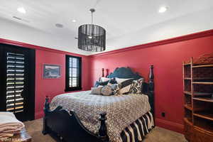 Bedroom featuring dark carpet and recessed lighting