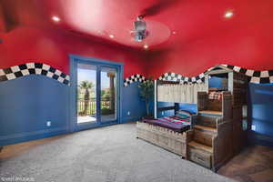 Carpeted bedroom with access to outside, a ceiling fan, and recessed lighting