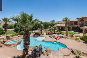 View of pool with a patio area, an in-ground hot tub, and a gazebo