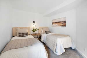 Carpeted bedroom featuring ornamental molding