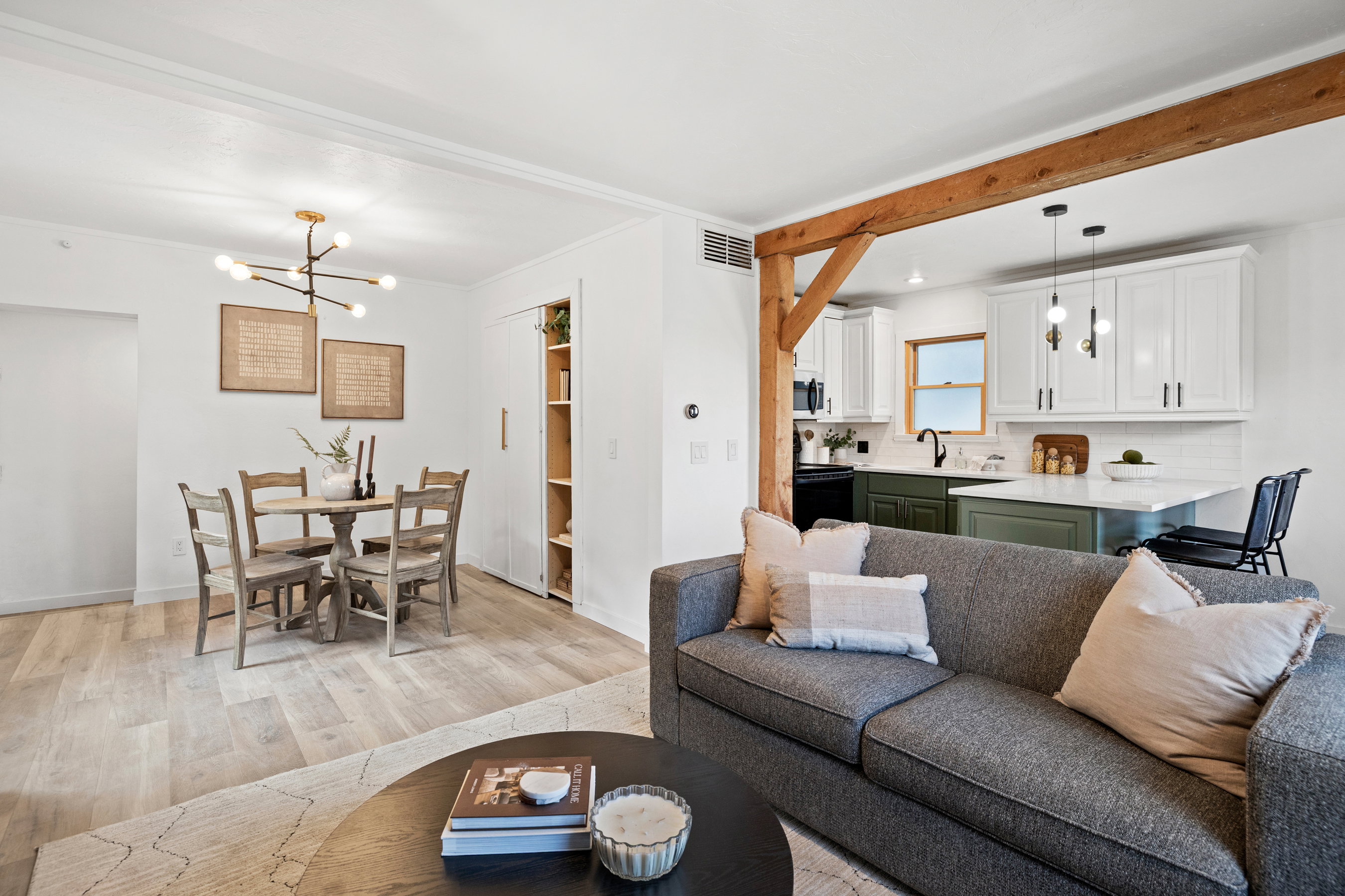Living area featuring a chandelier and light wood-style floors