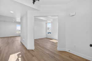 Unfurnished room with light wood finished floors and recessed lighting