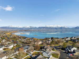 Aerial perspective of suburban area featuring a water and mountain view