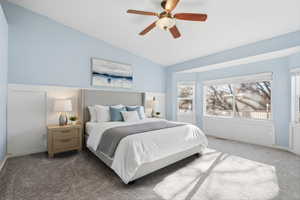 Bedroom with carpet, lofted ceiling, and ceiling fan
