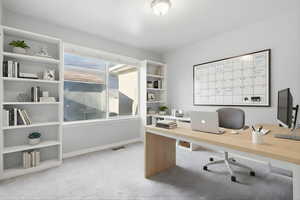 Home office with light carpet and baseboards