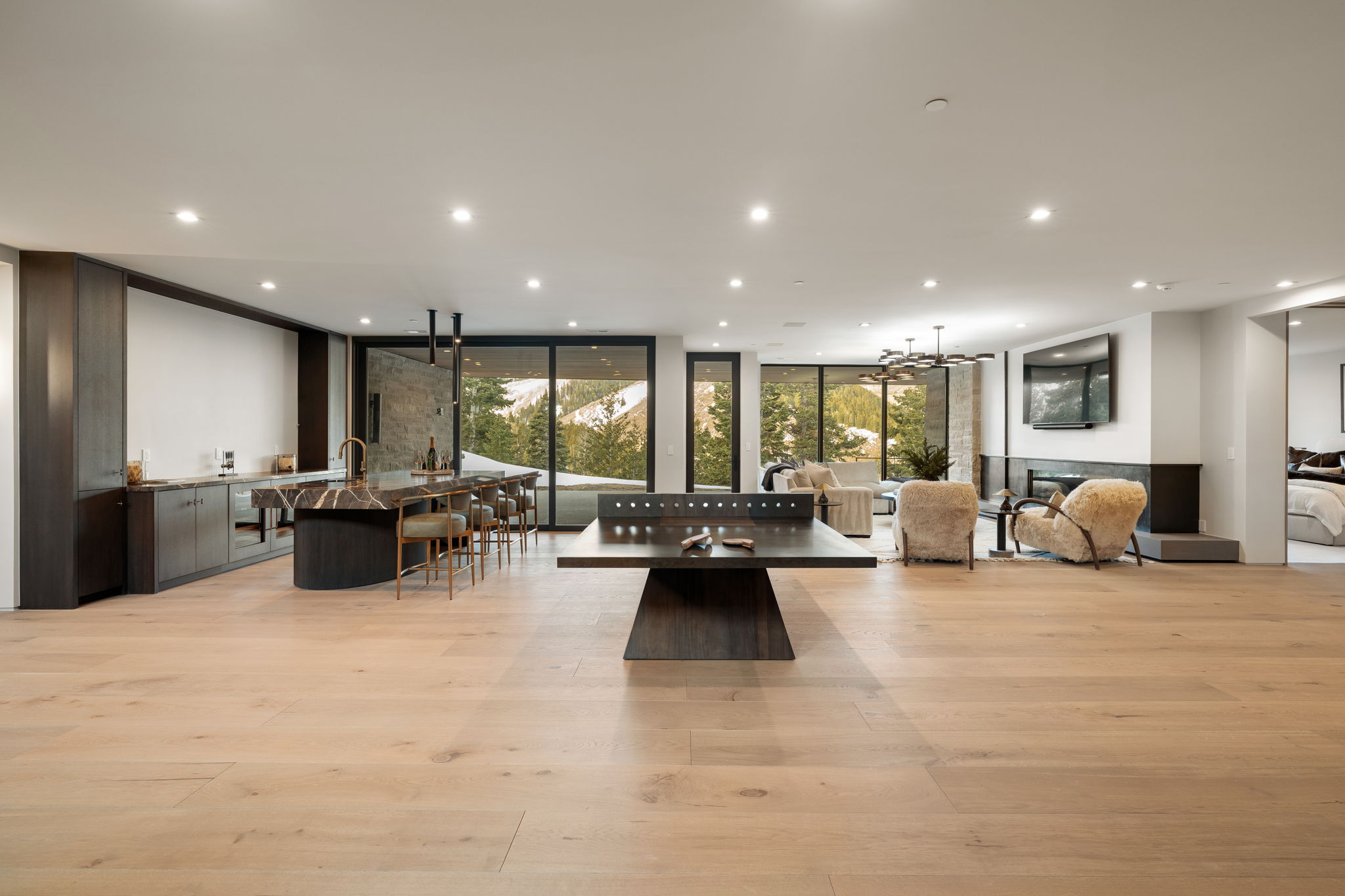 Community lobby with floor to ceiling windows and recessed lighting