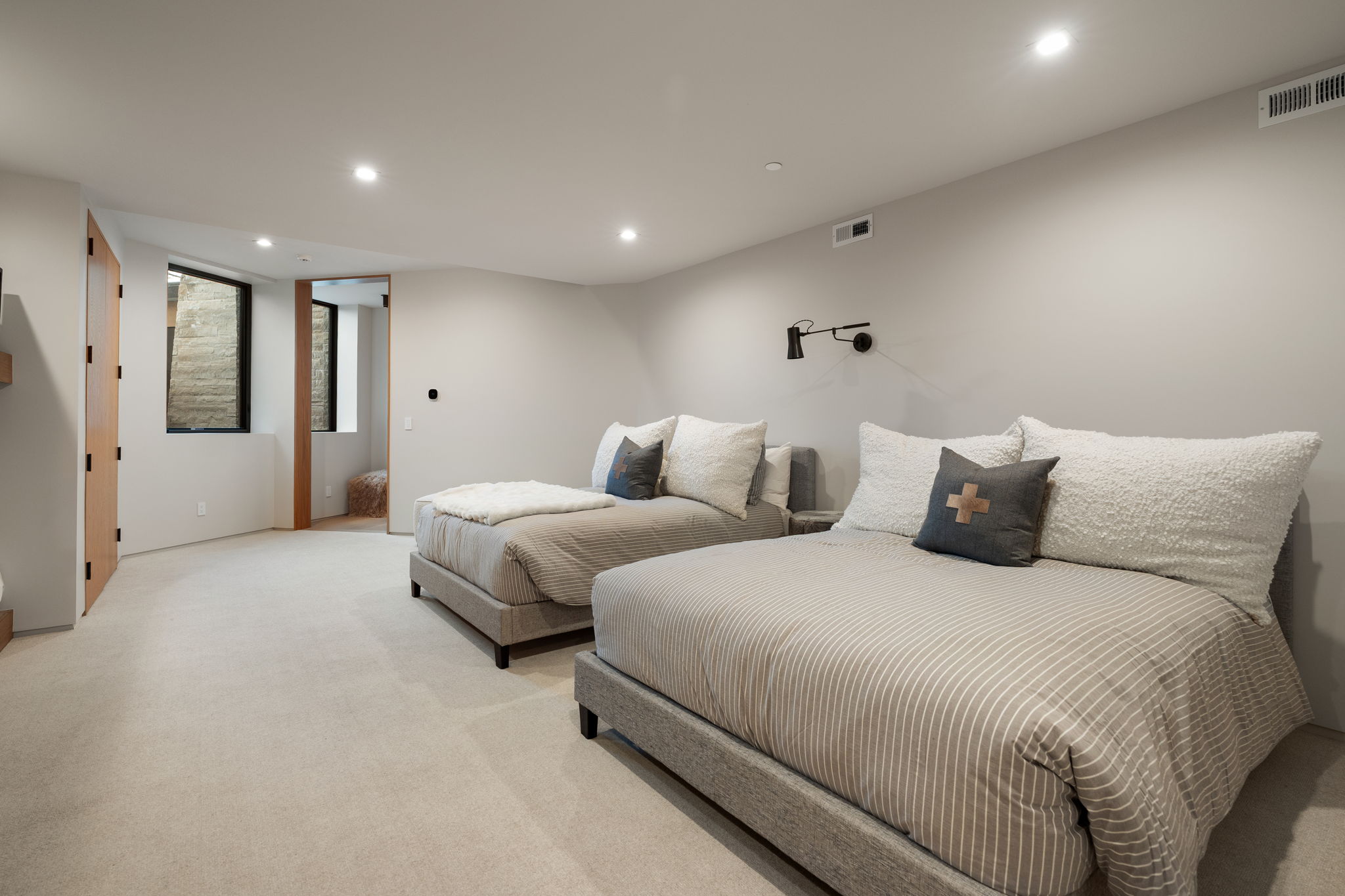 Bedroom with recessed lighting and light carpet