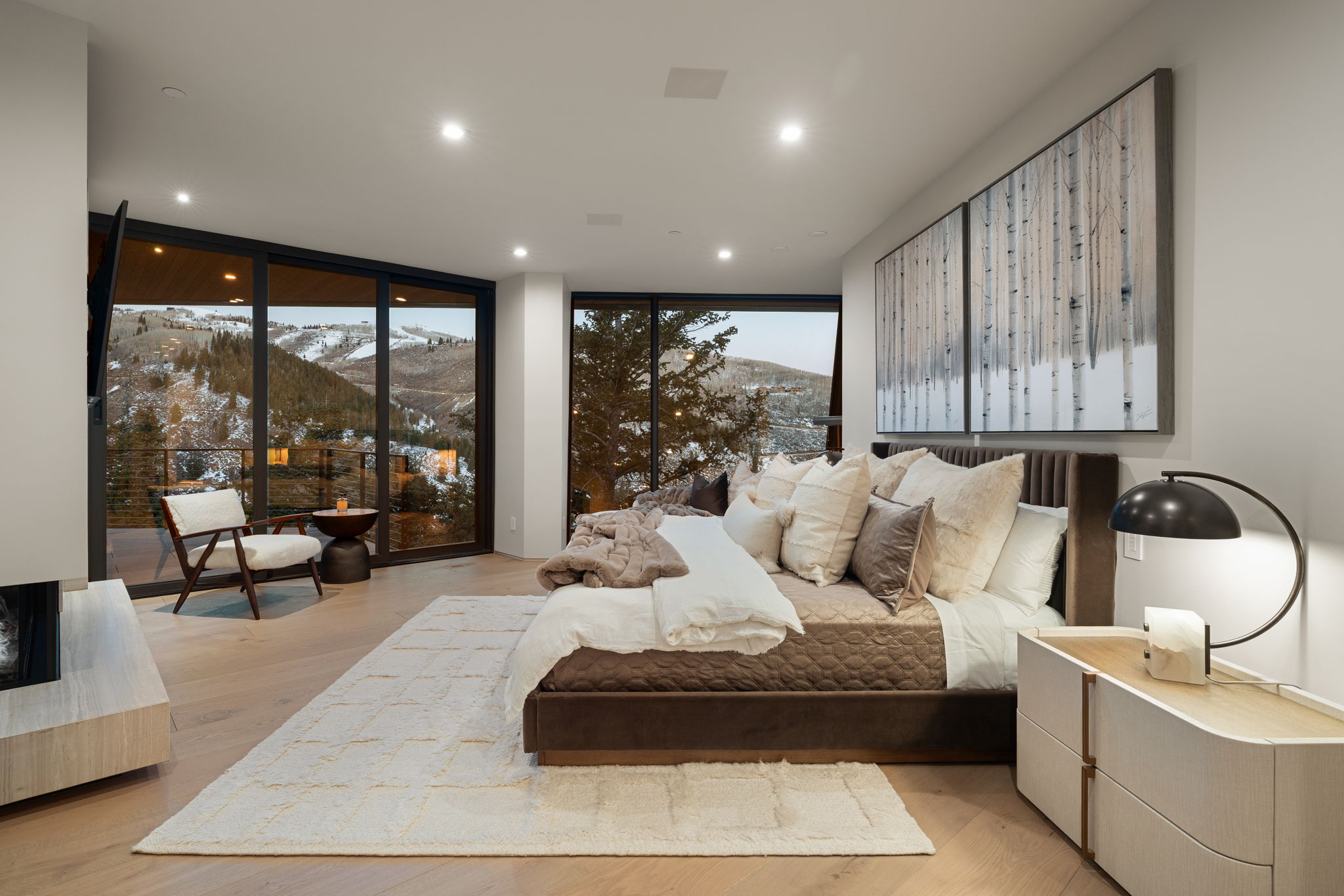 Bedroom featuring a mountain view, expansive windows, light wood finished floors, access to exterior, and recessed lighting