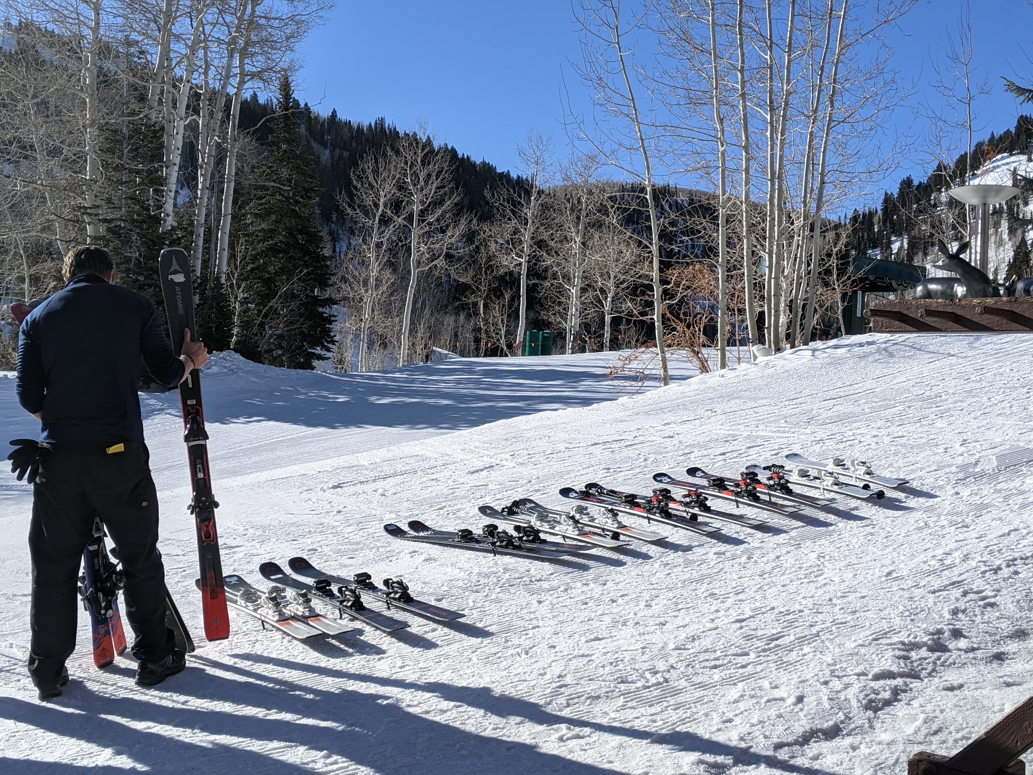 Skis and ski instructors waiting for you on the ski run.