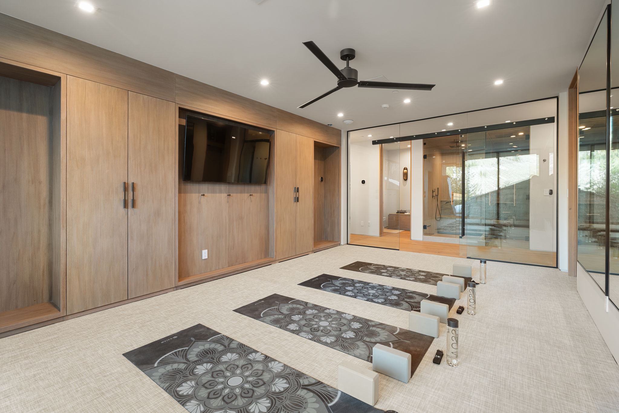 Bedroom featuring access to exterior, light carpet, and recessed lighting