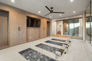 Bedroom featuring access to exterior, light carpet, and recessed lighting