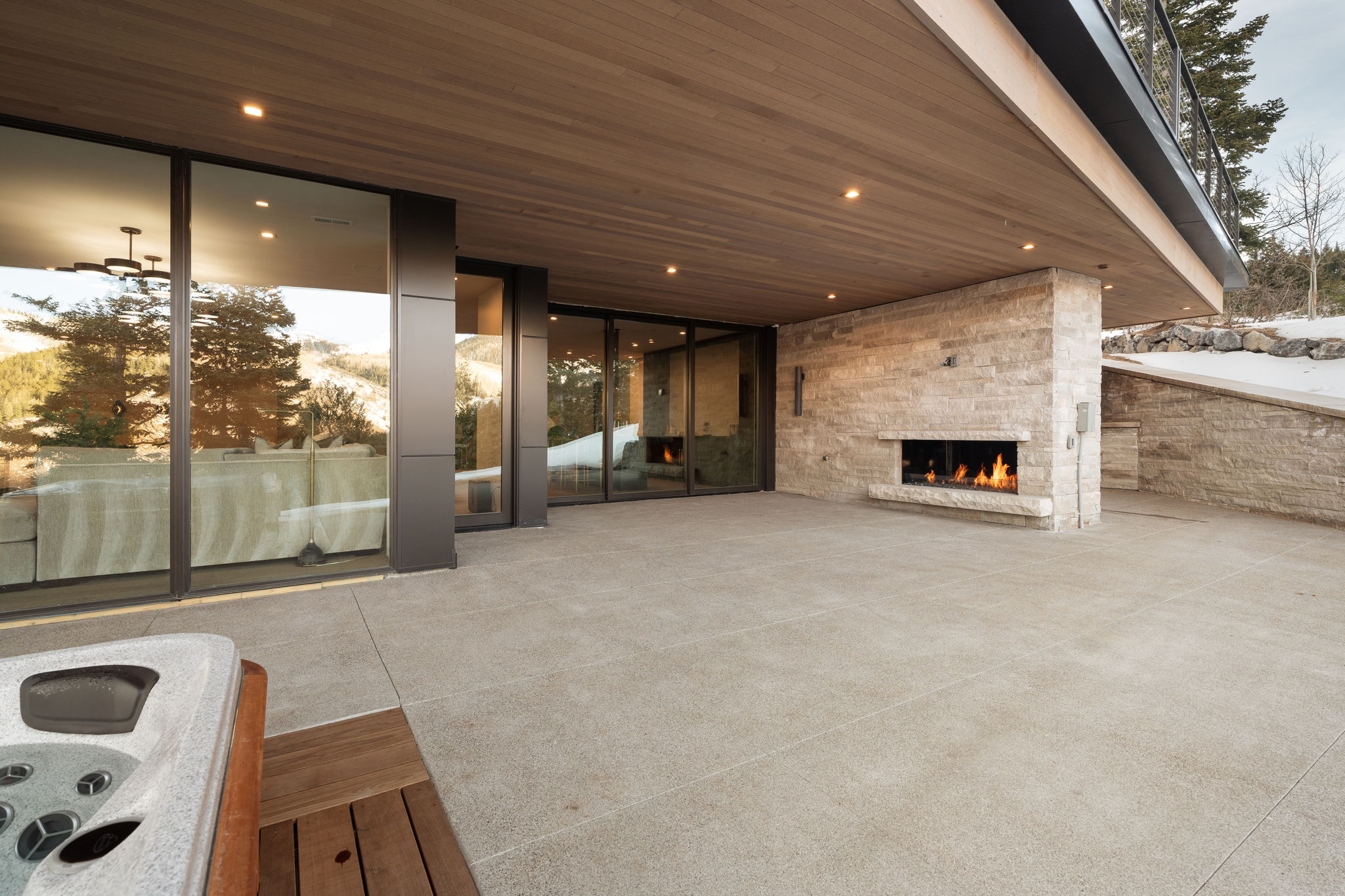 View of patio / terrace featuring an outdoor stone fireplace