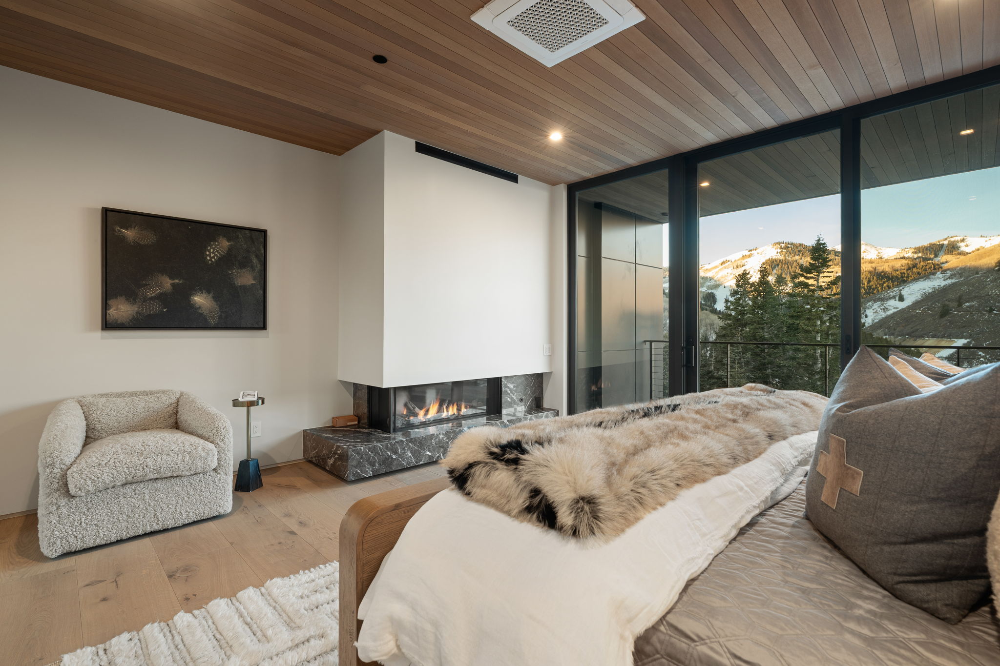 Bedroom with wooden ceiling, wood-type flooring, expansive windows, a mountain view, and recessed lighting