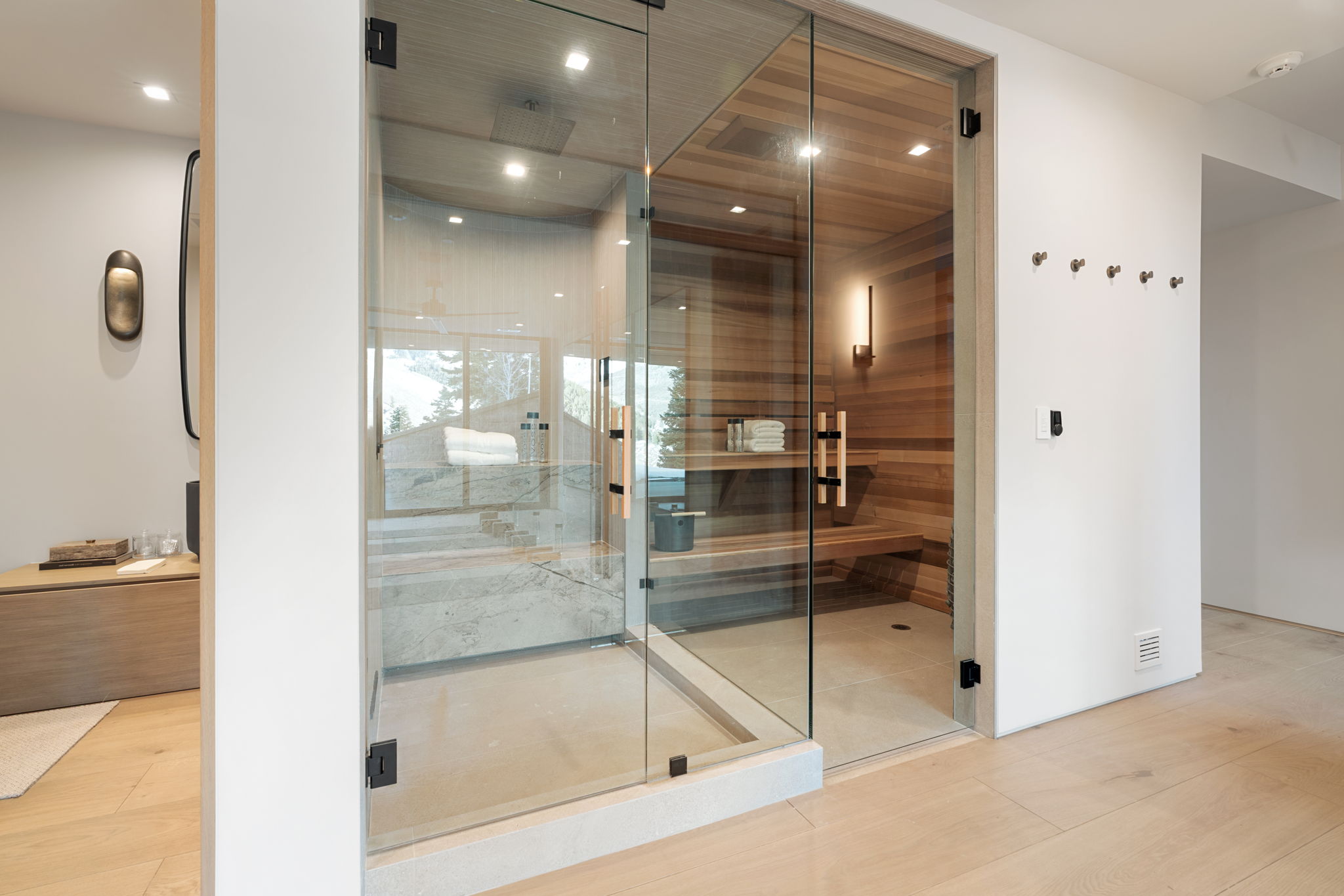 Relaxing sauna / steam room featuring wood finished floors and recessed lighting