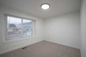 Spare room with carpet flooring and baseboards