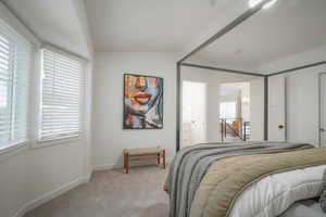 Bedroom featuring carpet and ensuite bath