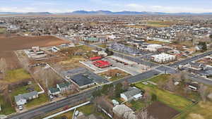 Aerial perspective of suburban area featuring a mountain backdrop