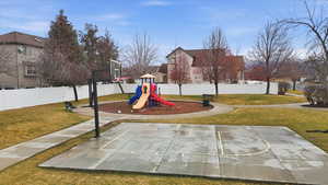 Communal playground featuring community basketball court