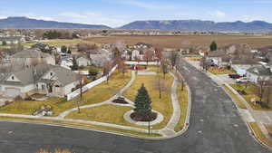 Aerial view of residential area featuring a mountainous background