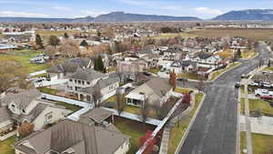 Aerial perspective of suburban area with a mountain backdrop