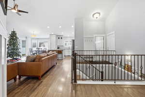 Living room featuring recessed lighting, wood-type flooring, and ceiling fan