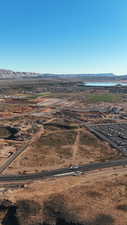 Aerial view of sparsely populated area with a desert landscape and a mountain backdrop
