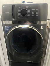 Washroom featuring washer /dryer combo