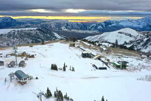 Snowy aerial view featuring a mountain view