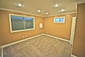 Unfurnished room with carpet, ornamental molding, and recessed lighting