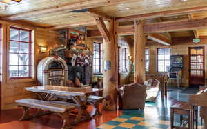 Sitting room with wood walls and wooden ceiling