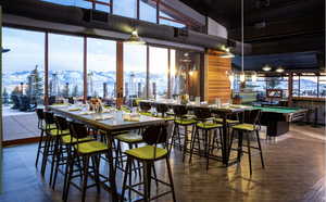 Dining space featuring a mountain view, a high ceiling, and billiards