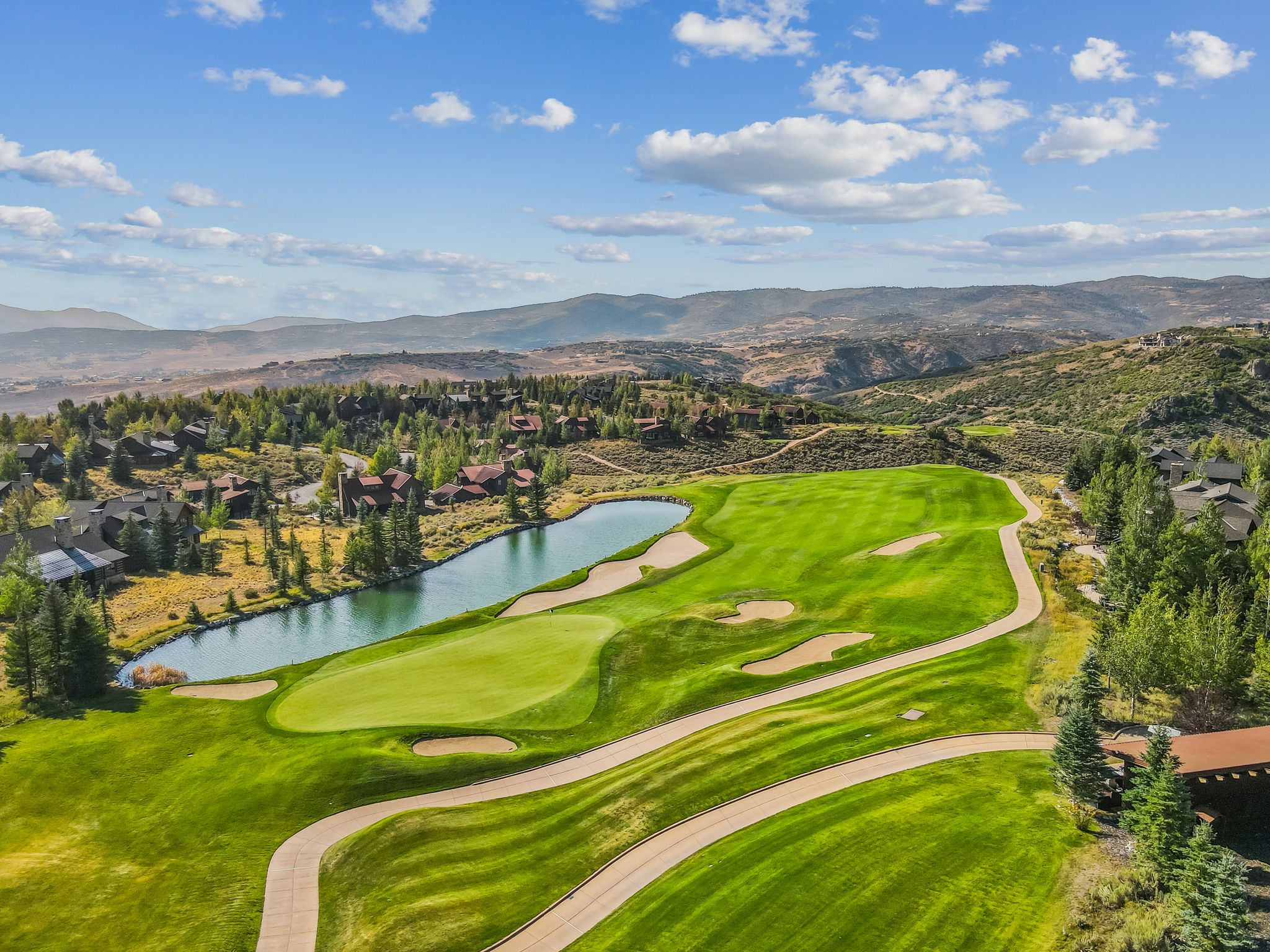 Surrounding community with a water and mountain view and view of golf course