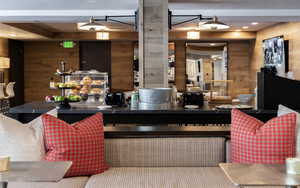 Bar area featuring wooden walls