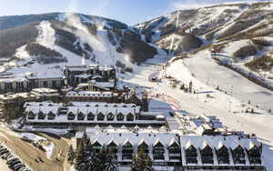 Snowy aerial view featuring a mountain view