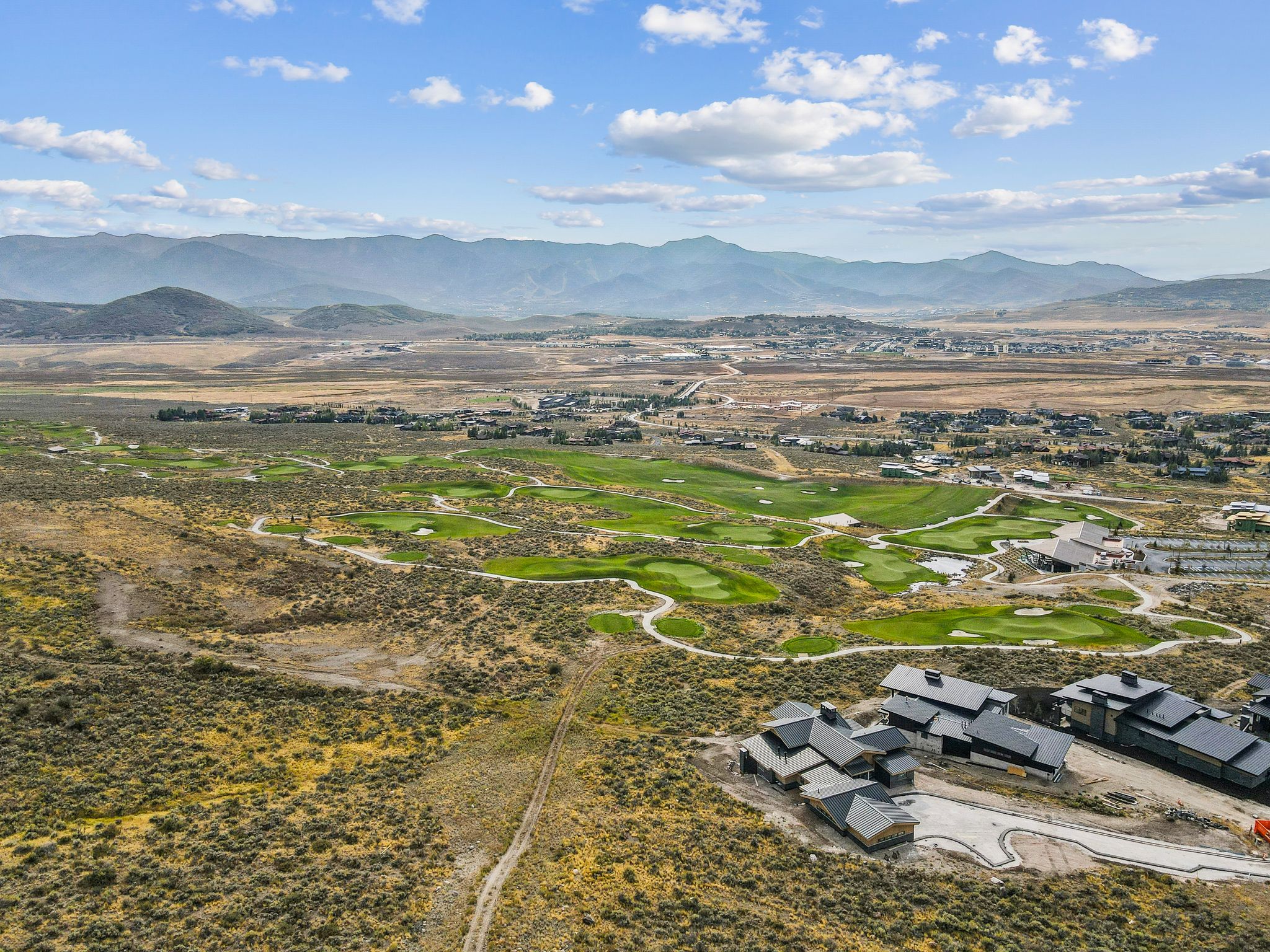 Aerial view of mountains and a golf club