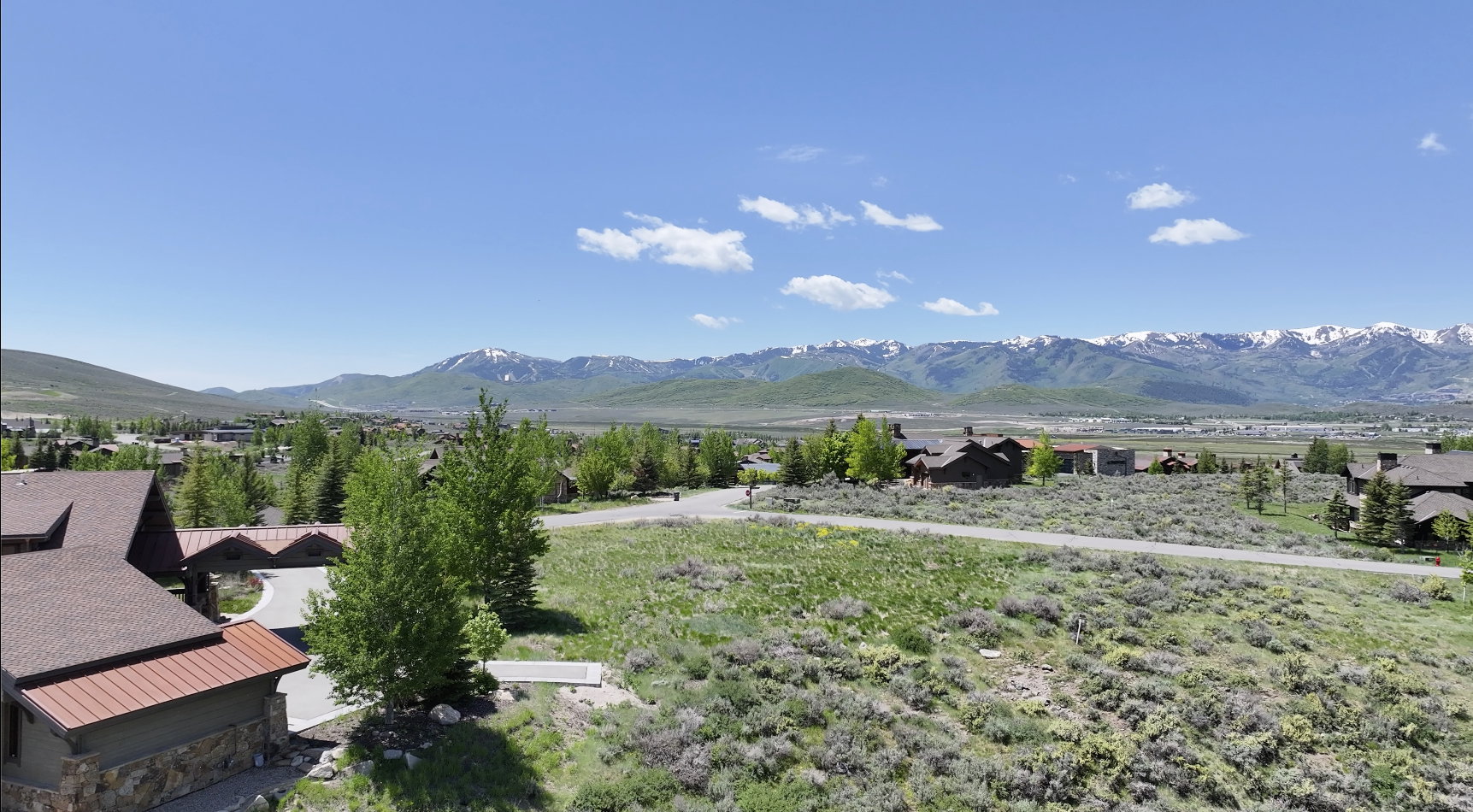 View of mountain background featuring nearby suburban area