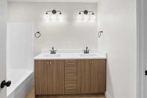Full bathroom featuring double vanity