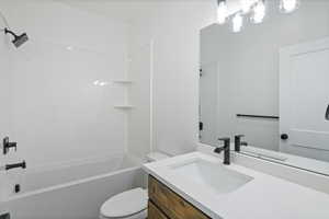 Bathroom featuring vanity and tub / shower combination