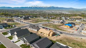 Aerial perspective of suburban area featuring a mountain backdrop