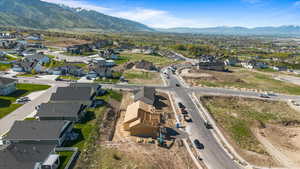 Aerial view of property's location featuring nearby suburban area and mountains