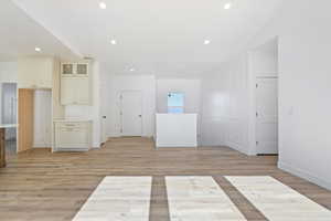 Spare room with light wood-type flooring and recessed lighting