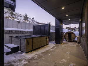 Snow covered patio featuring a patio