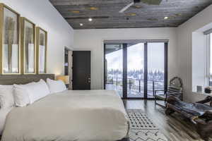 Bedroom with wooden ceiling, wood-type flooring, access to outside, recessed lighting, and ceiling fan