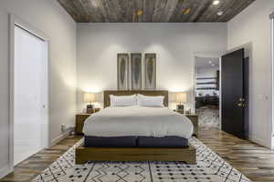 Bedroom featuring wood finished floors, recessed lighting, and wood ceiling