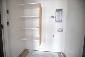 Washroom featuring washer hookup and baseboards