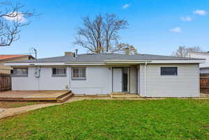 Rear view of house with roof with shingles