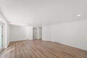 Unfurnished room featuring recessed lighting and light wood-style flooring