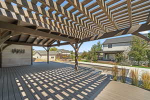 Deck with a residential view and a pergola